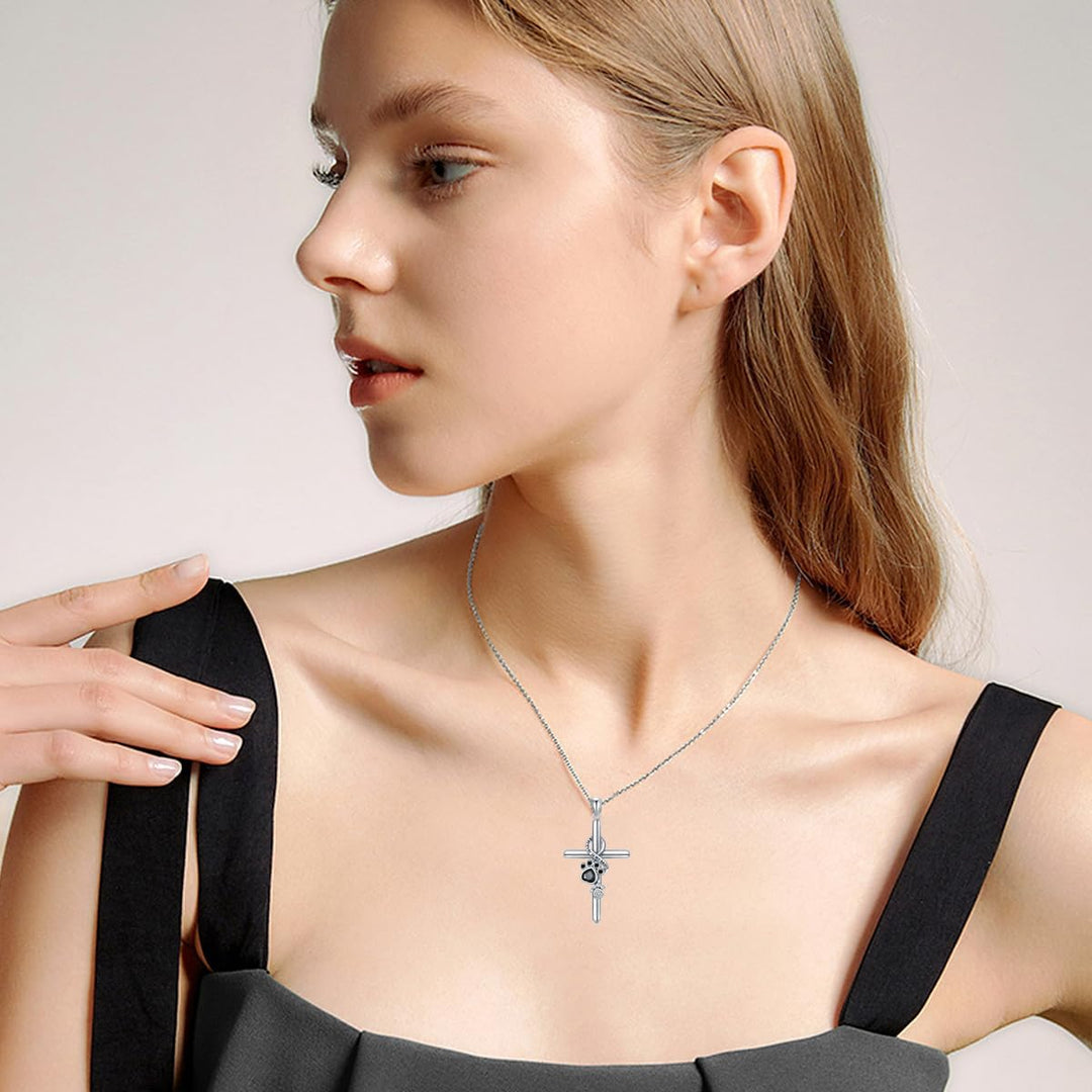 Silver paw and cross pendant necklace